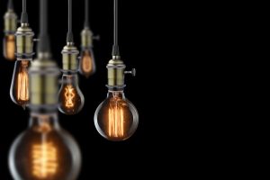 Old lightbulbs hanging in a dark room