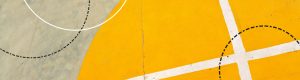 White lines on a grey and yellow basketball court.